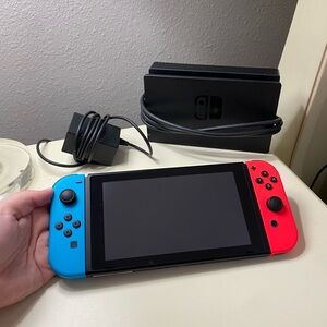 Nintendo Switch Console with Red and Blue Joy-Con